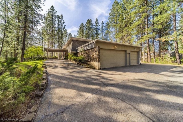 10511 E Cimmaron Dr, Spokane, WA 99206 - view of property exterior with driveway and an attached garage