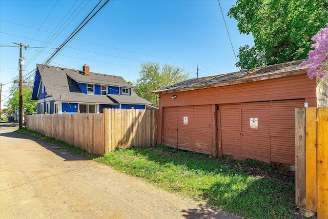 garage featuring fence