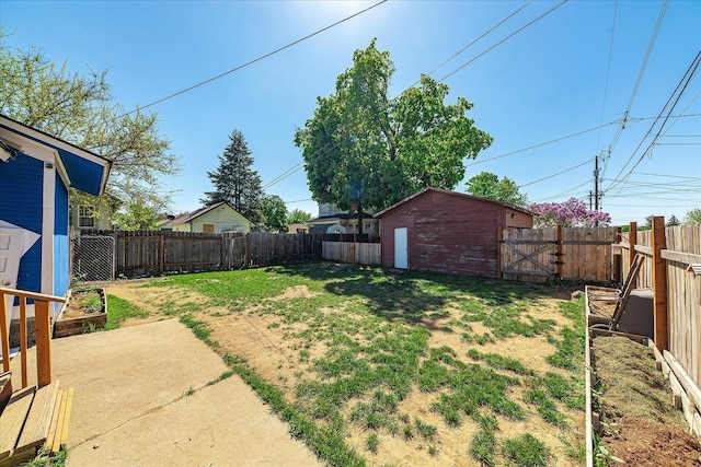 view of yard with an outbuilding and a patio