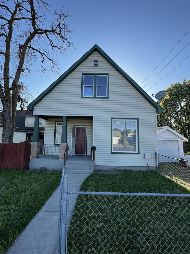 2209 N Washington St, Spokane, WA 99205 - bungalow-style home featuring a porch and a gate