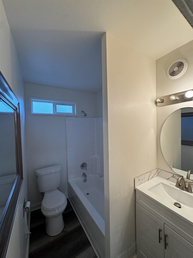 2209 N Washington St, Spokane, WA 99205 - full bathroom with toilet, wood finished floors, vanity, and shower / washtub combination