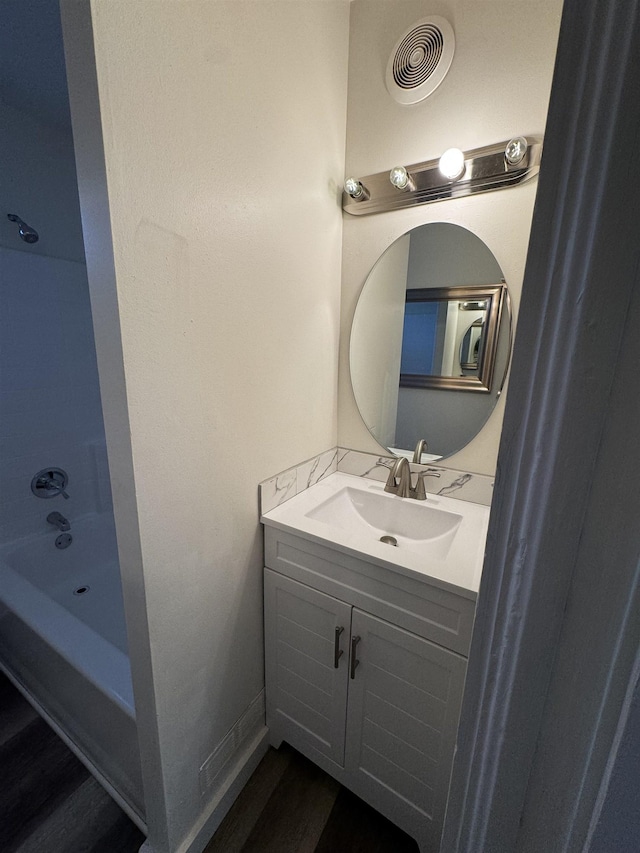 2209 N Washington St, Spokane, WA 99205 - bathroom featuring vanity, wood finished floors, and  shower combination