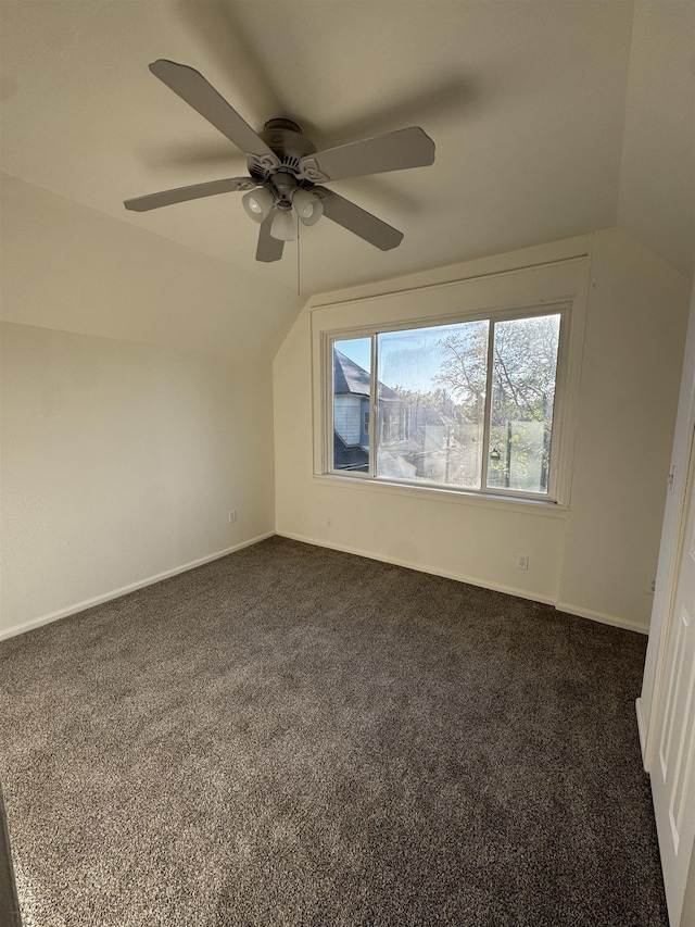 2209 N Washington St, Spokane, WA 99205 - unfurnished room featuring lofted ceiling, a ceiling fan, dark colored carpet, and baseboards