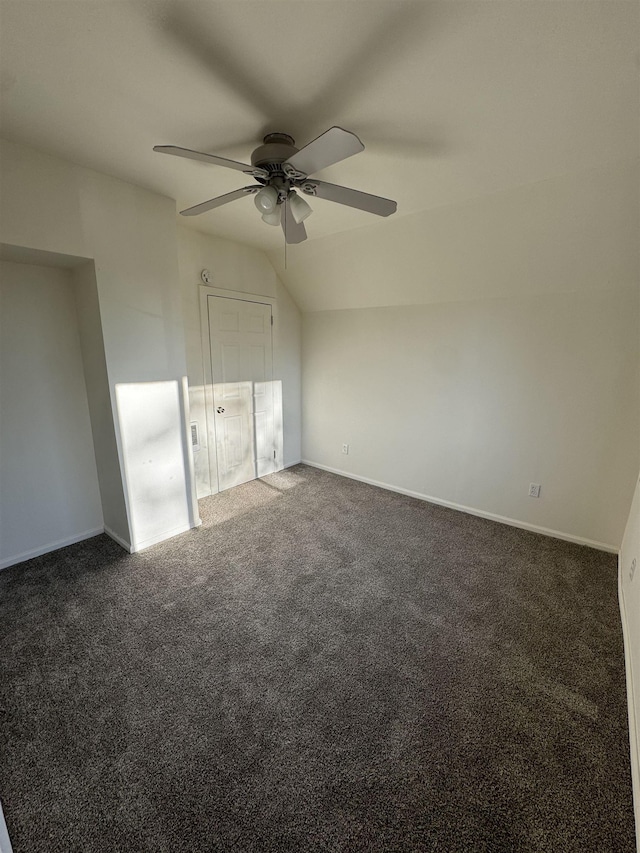 2209 N Washington St, Spokane, WA 99205 - unfurnished bedroom with dark colored carpet, baseboards, vaulted ceiling, and a ceiling fan