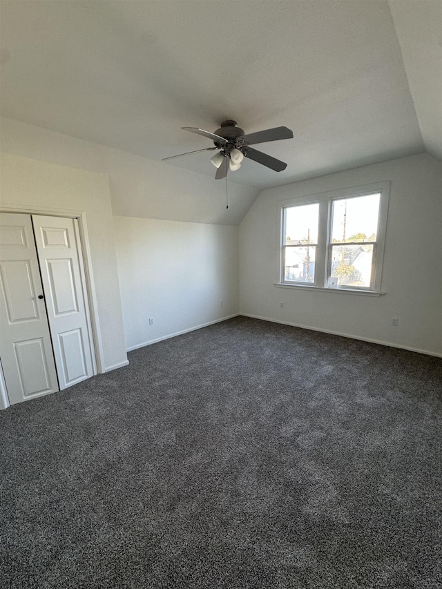 2209 N Washington St, Spokane, WA 99205 - additional living space featuring vaulted ceiling, ceiling fan, dark carpet, and baseboards