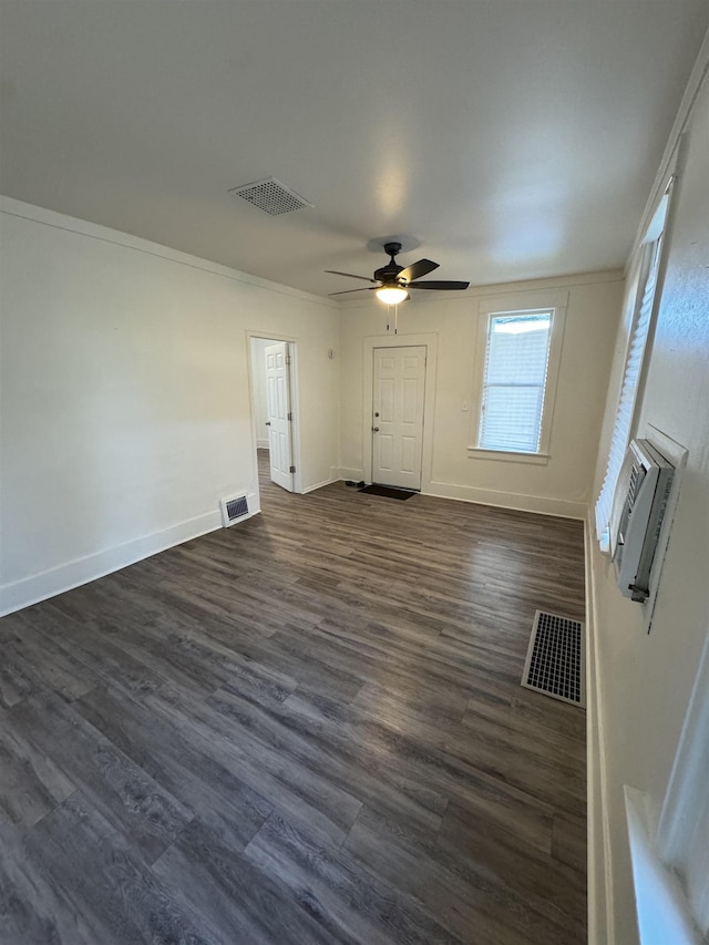 2209 N Washington St, Spokane, WA 99205 - unfurnished living room with a wall mounted AC, ceiling fan, dark wood-type flooring, and baseboards