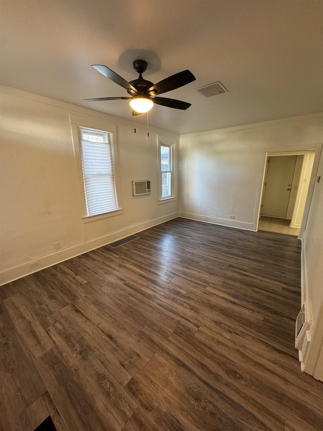 2209 N Washington St, Spokane, WA 99205 - empty room with dark wood finished floors, a ceiling fan, baseboards, and a wall mounted AC