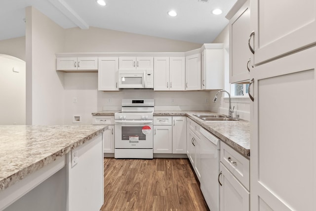 18420 E 1st Ln, Spokane Valley, WA 99016 - kitchen with white appliances, a sink, vaulted ceiling, white cabinetry, and light countertops