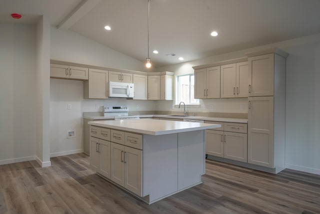 18420 E 1st Ln, Spokane Valley, WA 99016 - kitchen featuring white appliances, a sink, a center island, light countertops, and dark wood-type flooring