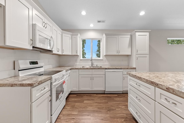 18420 E 1st Ln, Spokane Valley, WA 99016 - kitchen featuring white appliances, a sink, recessed lighting, light countertops, and white cabinets