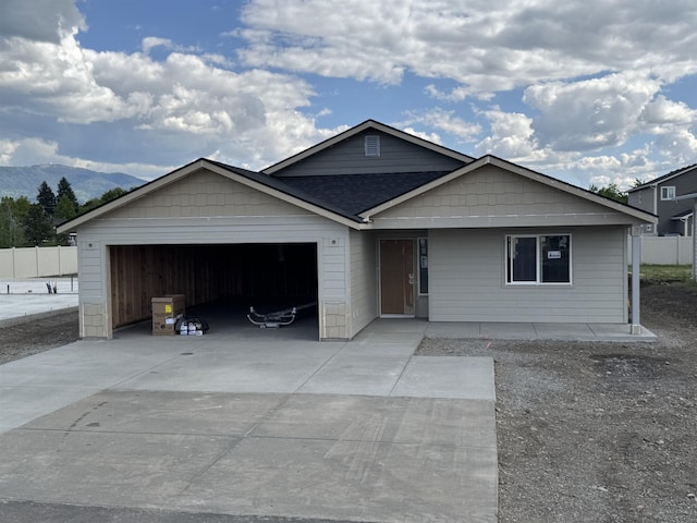 18420 E 1st Ln, Spokane Valley, WA 99016 - view of front of house with a garage, driveway, and a mountain view