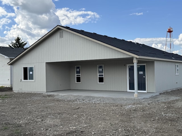 18420 E 1st Ln, Spokane Valley, WA 99016 - rear view of house with a patio and a shingled roof