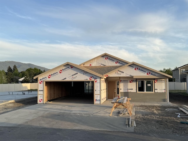18420 E 1st Ln, Spokane Valley, WA 99016 - property under construction featuring an attached garage, a mountain view, and concrete driveway