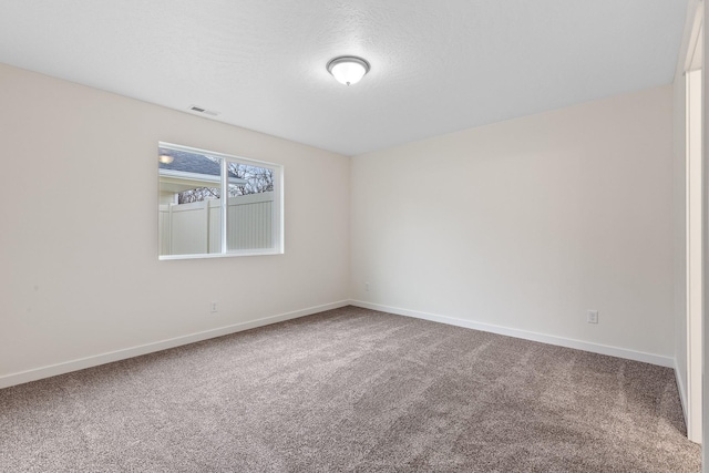 18420 E 1st Ln, Spokane Valley, WA 99016 - carpeted spare room featuring baseboards and a textured ceiling