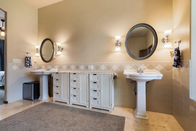 21718 W Watt Rd, Cheney, WA 99004 - bathroom featuring tile walls, tile patterned floors, and wainscoting