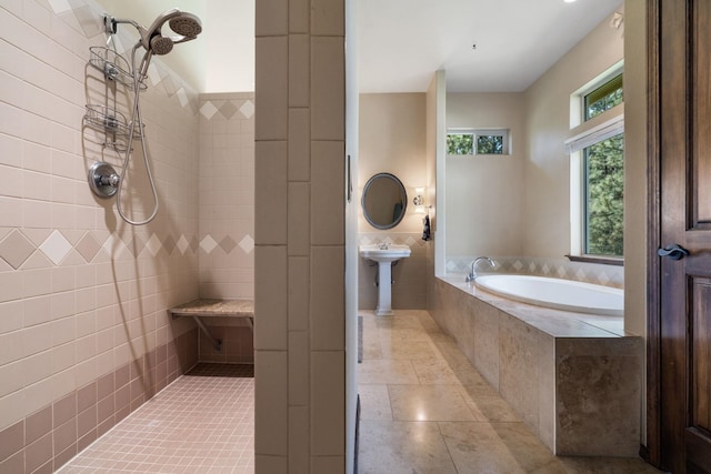 21718 W Watt Rd, Cheney, WA 99004 - bathroom featuring a tile shower, a garden tub, tile patterned floors, and tile walls