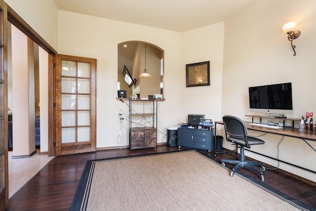 21718 W Watt Rd, Cheney, WA 99004 - home office with hardwood / wood-style flooring, arched walkways, and baseboards