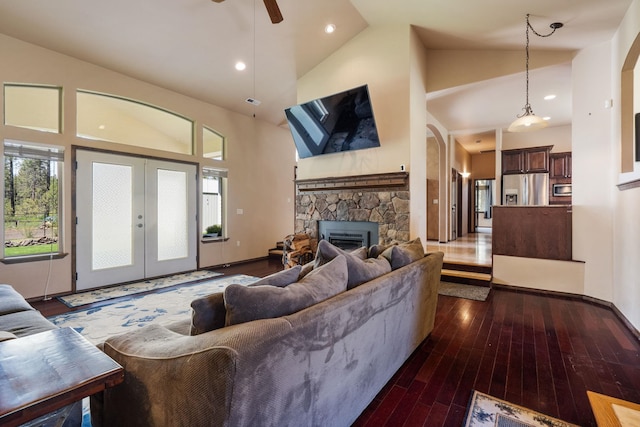 21718 W Watt Rd, Cheney, WA 99004 - living room featuring high vaulted ceiling, dark wood-type flooring, a fireplace, french doors, and ceiling fan