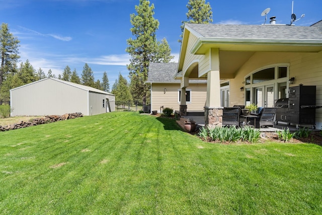 21718 W Watt Rd, Cheney, WA 99004 - view of green lawn with cooling unit and a patio area