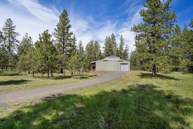 21718 W Watt Rd, Cheney, WA 99004 - view of dirt / gravel driveway with a pole building
