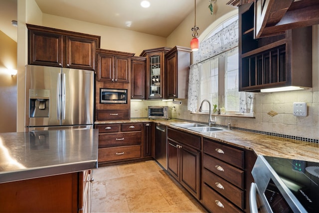 21718 W Watt Rd, Cheney, WA 99004 - kitchen featuring appliances with stainless steel finishes, a sink, tasteful backsplash, and pendant lighting