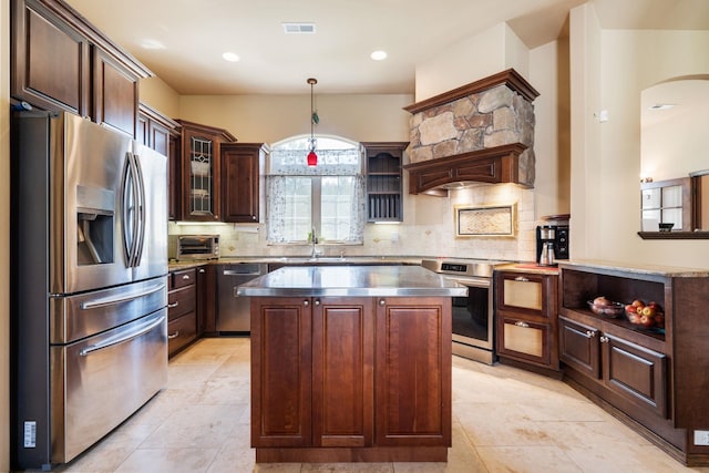 21718 W Watt Rd, Cheney, WA 99004 - kitchen featuring appliances with stainless steel finishes, open shelves, a kitchen island, backsplash, and recessed lighting