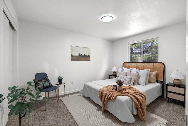bedroom featuring carpet, a closet, and baseboards
