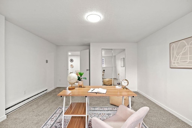 carpeted office featuring a baseboard heating unit, baseboards, and a textured ceiling