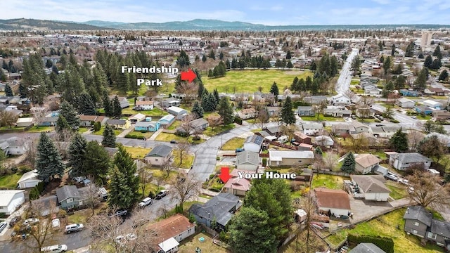 aerial overview of property's location featuring nearby suburban area and mountains
