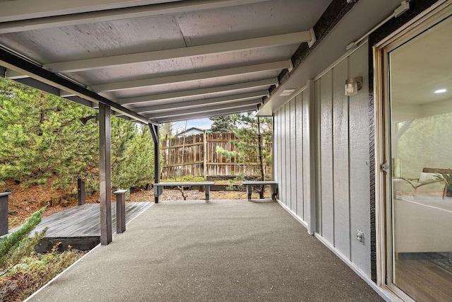 view of patio featuring fence