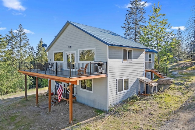 712 Alpen View Ln, Newport, WA 99156 - rear view of property featuring stairs, a deck, and metal roof