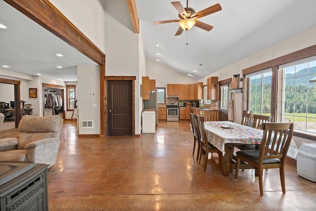 dining space with recessed lighting, finished concrete floors, a ceiling fan, and high vaulted ceiling