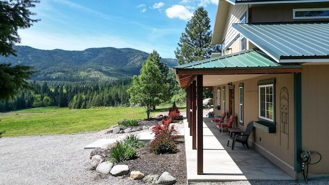 view of patio / terrace featuring a mountain view
