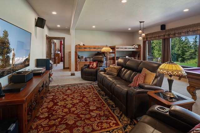 living area featuring light carpet and recessed lighting