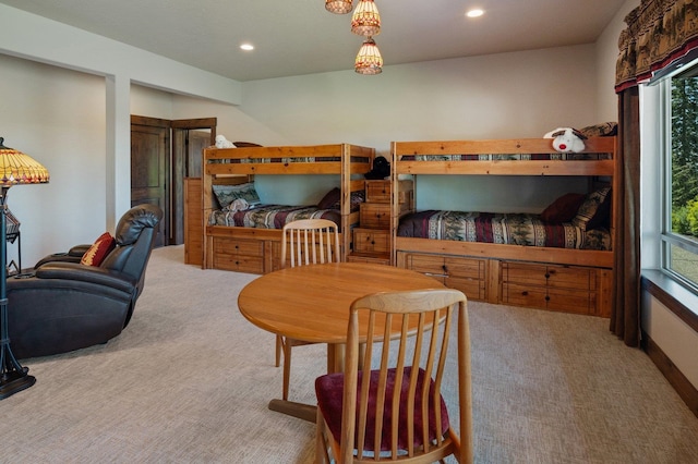 carpeted bedroom with recessed lighting and multiple windows