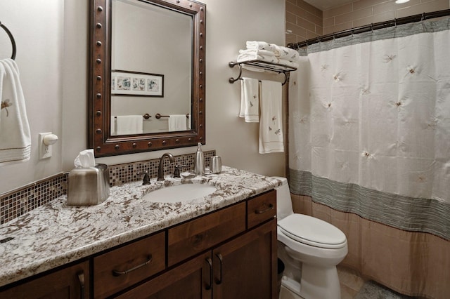bathroom with vanity, toilet, and a shower with curtain