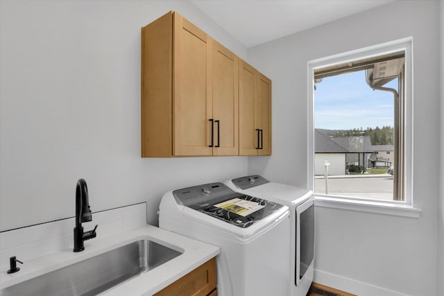 7025 E Beverly Ave, Spokane Valley, WA 99212 - laundry room with cabinet space and washing machine and dryer