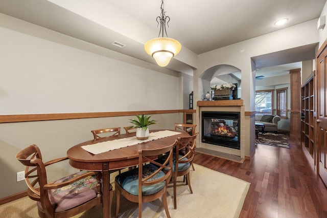 316 S 10th Pl, Coeur D Alene, ID 83814 - dining space with wood finished floors and a multi sided fireplace