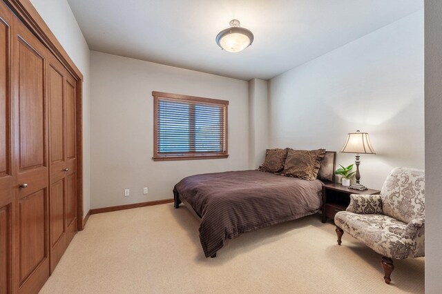 316 S 10th Pl, Coeur D Alene, ID 83814 - bedroom featuring light carpet, a closet, and baseboards