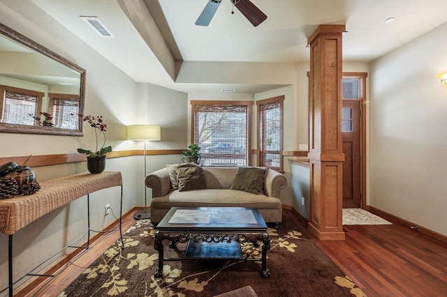 316 S 10th Pl, Coeur D Alene, ID 83814 - living area featuring ornate columns, wood finished floors, ceiling fan, baseboards, and plenty of natural light