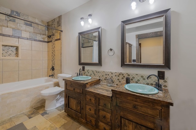 11818 N Mountain Trail Ln, Spokane, WA 99217 - bathroom with toilet, tasteful backsplash, tiled shower / bath combo, and double vanity