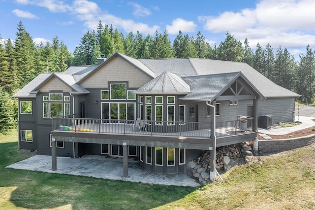 11818 N Mountain Trail Ln, Spokane, WA 99217 - rear view of house featuring a patio, a deck, a yard, and cooling unit