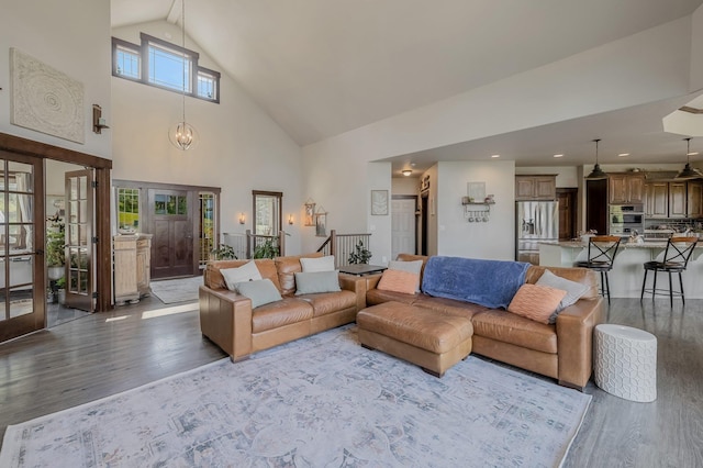 11818 N Mountain Trail Ln, Spokane, WA 99217 - living room featuring wood finished floors and high vaulted ceiling