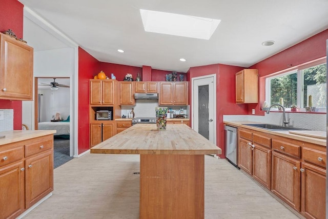 91 Moonlight Ln, Newport, WA 99156 - kitchen with butcher block countertops, stainless steel appliances, light wood-type flooring, under cabinet range hood, and vaulted ceiling