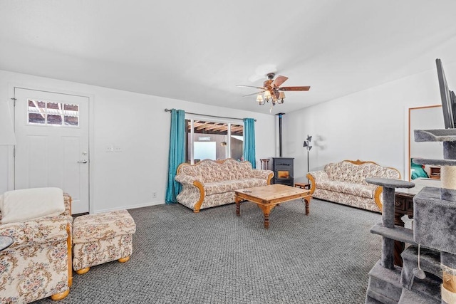 91 Moonlight Ln, Newport, WA 99156 - living room featuring a wood stove, plenty of natural light, carpet flooring, and a ceiling fan