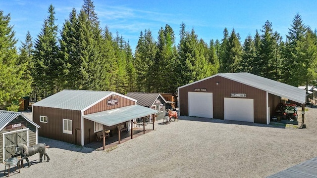 91 Moonlight Ln, Newport, WA 99156 - garage featuring a detached garage and gravel driveway