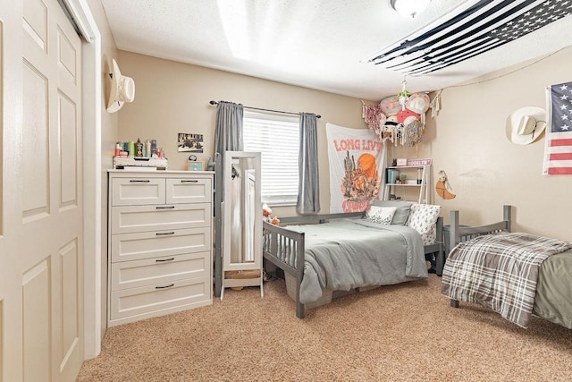 bedroom featuring light carpet