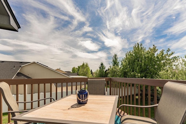 wooden deck with outdoor dining space