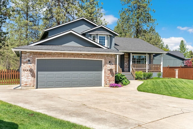 7007 N Tucannon Ct, Spokane, WA 99208 - craftsman-style home with brick siding, concrete driveway, covered porch, and a garage