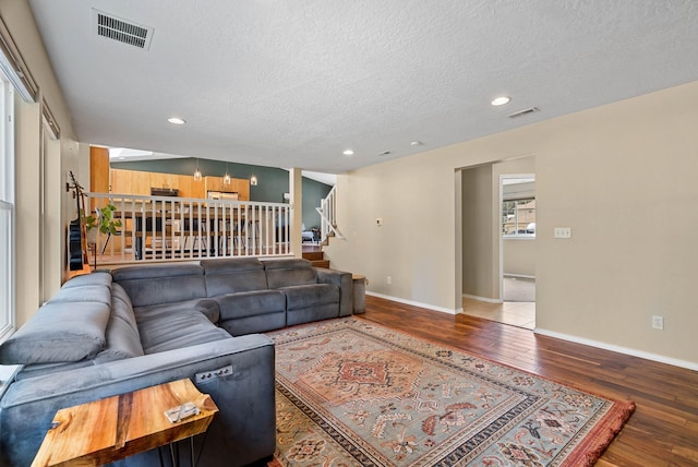 7007 N Tucannon Ct, Spokane, WA 99208 - living room with hardwood / wood-style flooring, stairs, a textured ceiling, and recessed lighting